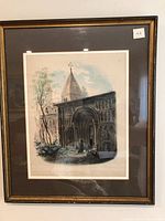 Framed watercolor painting showing the church,"St. Jakob, Regensburg". View of the entrance façade and tower, with trees and sky background.