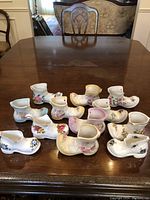 Closer angled photo showing collection arranged on polished wooden table with good light to reveal shine and colors.