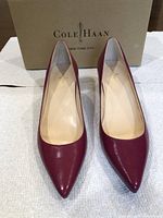 Front view of Cole Haan burgundy leather women's pumps, size 5B, new condition with original box.
