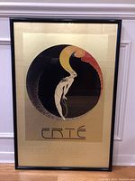 Framed Erté “L’Amour” poster showing gold-toned mat, black metal frame, and signature beneath artwork