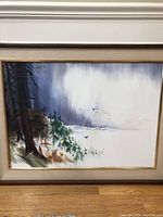 Framed watercolor landscape painting showing trees, snow, and birds in flight, signed by Zoltan Szabo.