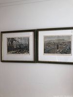 Two framed steel engravings hung side by side on a wall showing panoramic views of Montreal.