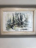 Framed watercolor painting showing abstracted landscape with trees, signed by John Bennett in bottom right corner.