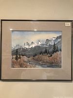 Framed watercolor painting of Bow Valley mountains and river, matted and framed under glass, showing natural scenery and signature.