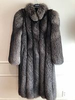 Front view of full-length silver fox fur coat on hanger