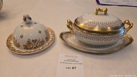 Full view of butter dish with lid and Limoges gravy boat with lid and underplate, showing gold and white porcelain with detailed patterns.