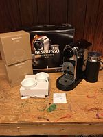 Machine, boxed machine, two boxes of LUME mugs, two mugs in white tray