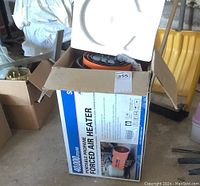 Another view of the box showing product name and heating specifications.