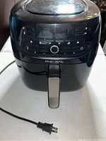 Front view of black Power XL air fryer showing handle, control buttons and Power XL branding.