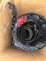 Top view of the open Shop-Vac showing vacuum hose coiled inside the main tank and internal components.