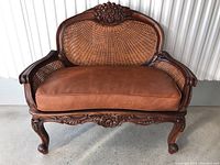 Front view of loveseat showing overall shape and condition.