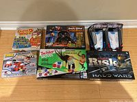 All six boxed games arranged on floor showing full lot contents.