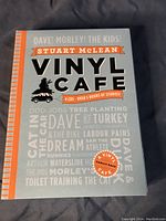Front cover of Vinyl Cafe Family Pack 4-CD set by Stuart McLean with orange and grey design