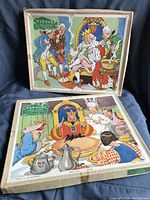 Two original boxed Victory wooden jigsaw puzzles featuring 'Sing a Song of Sixpence' illustrations.