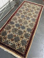 Full view of the entire rug laid flat on the floor beside a glass table