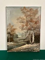 Full view of the signed oil on canvas landscape painting depicting trees, a stream, and distant hills in autumnal colors.