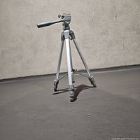 Sunpak PlatinumPlus 5800D tripod fully extended and set up showing aluminum legs and pan-tilt head with handle.