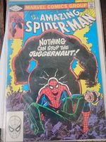 Photo of a vintage The Amazing Spiderman comic book with Juggernaut on the cover, measuring approximately 11 inches.