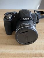 Front view of Nikon Coolpix P600 with lens cap on