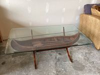 Front perspective showing entire canoe table and glass top