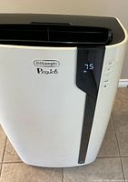 Front view of DeLonghi Pinguino portable air conditioner showing digital control panel