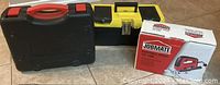 Photo showing the black toolbox, yellow metal toolbox, and Job Mate variable speed jigsaw box.