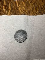 Reverse of 1864 Nova Scotia one cent coin showing detailed crown, wreath, and date.