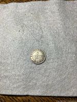 Reverse side of the 1917 Newfoundland 5 cent coin showing denomination and year '5 CENTS 1917' and decorative wreath.