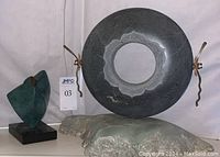 Both sculptures displayed side by side