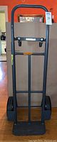 Front view of the full Milwaukee adjustable hand truck showing frame, wheels, and handle.