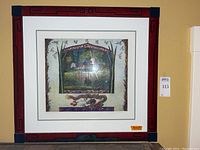 Full view of framed aquatint etching against a yellow wall, showing the detailed artwork and frame design.