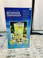 Photo of boxed 3 gallon beverage dispenser with details listed on the box.