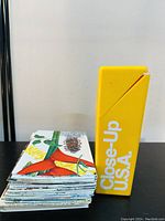 Stack of colorful Close-Up U.S.A. maps with yellow storage box labeled 'Close-Up U.S.A.'