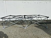 Open mattress frame with metal platform laid out