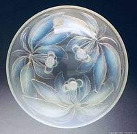 Top view of the opaline glass bowl showing intricate floral design of leaves and berries with frosted and translucent qualities.