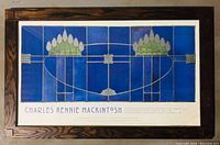 Framed exhibition poster displaying the stained glass design by Charles Rennie Mackintosh, in Arts and Crafts oak frame showing wood grains and clean lines.