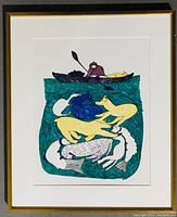 Full view of the framed Inuit lithograph print showing the artwork and frame condition.