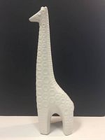 Front left angle view showing the full height and textured surface of the giraffe figurine on a black background.
