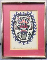 Framed First Nations print with wave design and central figure in black, red, and blue, signed by Patrick Rober. 8x10 inches with red mat and silver frame.
