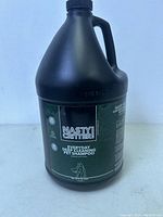 Front label view of a large black plastic gallon container of Nasty Critter Everyday Deep Cleaning Pet Shampoo