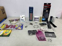 Wide photo of all miscellaneous items including chalk, jewelry, haircare, and accessories arranged on table