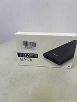 Box labeled POWER BANK with image of black rectangular power bank
