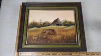 Framed oil painting showing full view of the artwork, including the rustic barn and applecart in field.