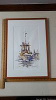 Full view of framed watercolor painting showing a marine boat at dock with ruler for scale.