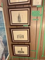 Photo of five framed Toronto historic building prints mounted on a wood-paneled wall with green note showing lot details and dimensions.