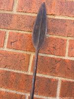 Close-up image of the spear blade showing its shape and patina.