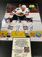 Signed 8x10 photo of Martin Havlat in Chicago Blackhawks uniform with COA