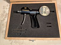 Fowler Superbore Pistol Grip bore gauge with digital readout in wooden case with foam insert and calibration rods.