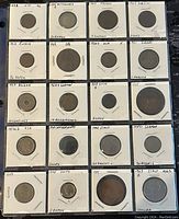 Image showing 20 assorted world coins from 1884-1963 in individual holders with inscriptions of country and year.