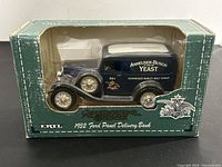 Front view of the 1932 Ford Panel Delivery bank inside original green box showing Anheuser-Busch Yeast branding.